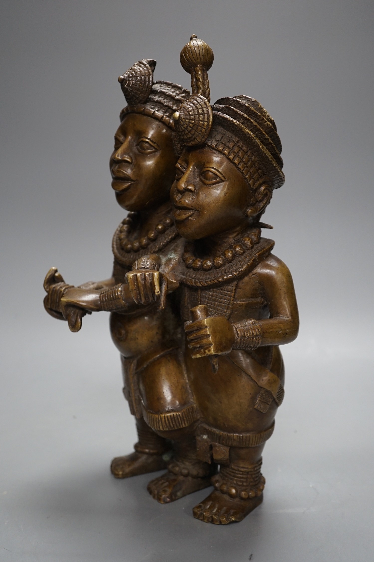 A Benin style bronze twin figure group, 33cm